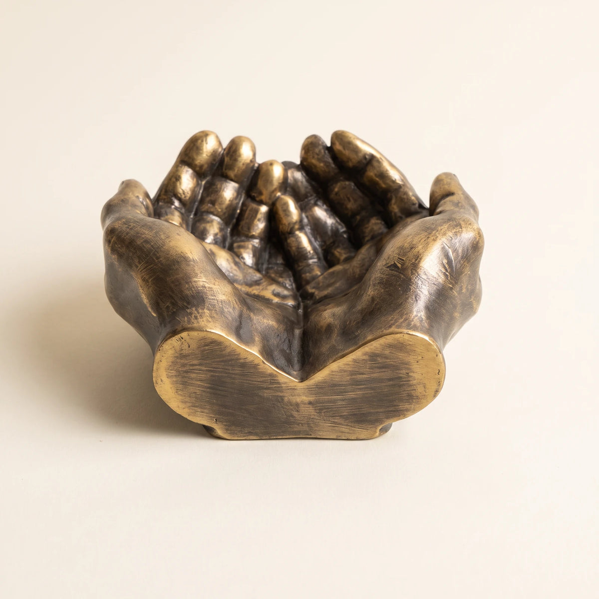 Hands — Gold ashtray, front view
