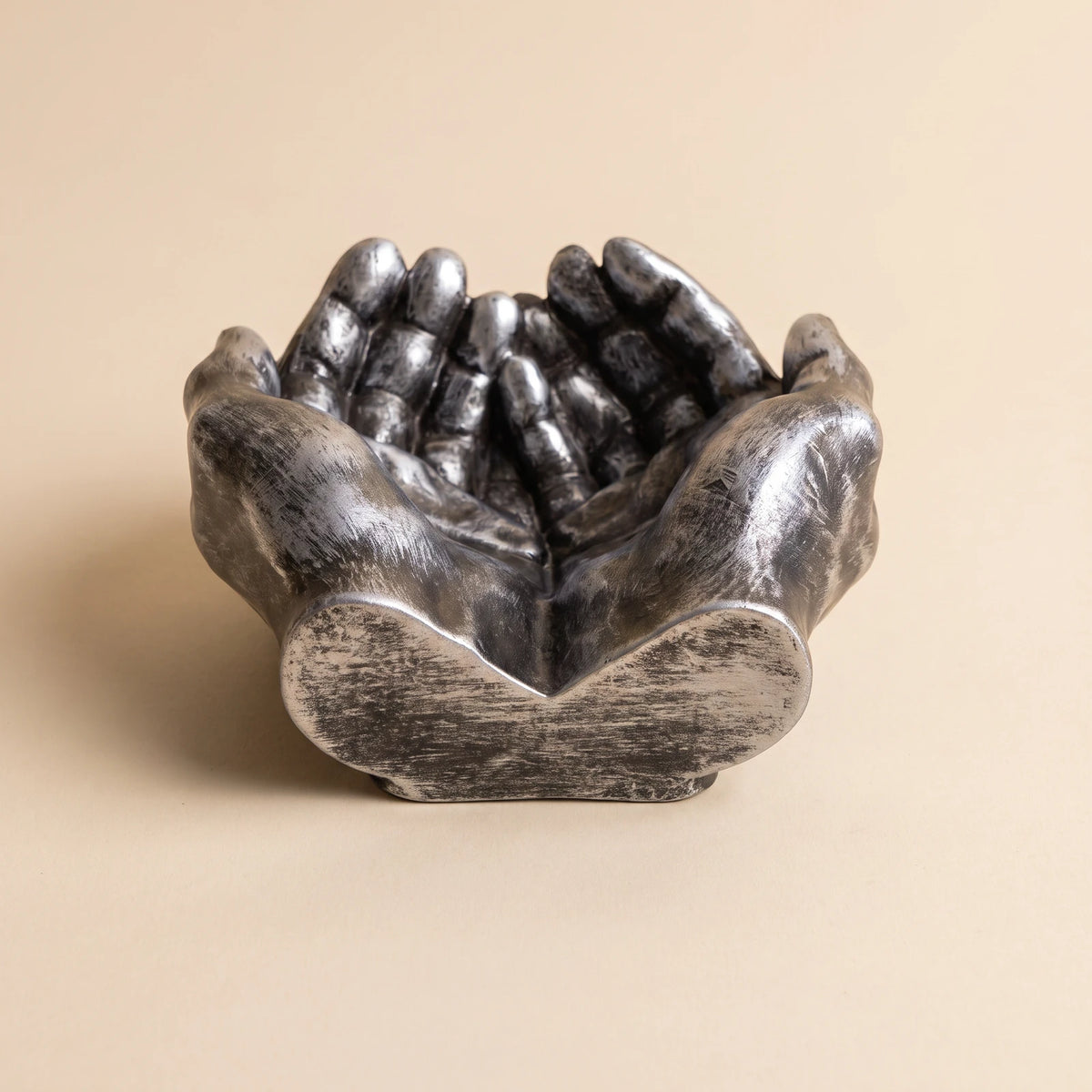 Hands — Silver ashtray, front view